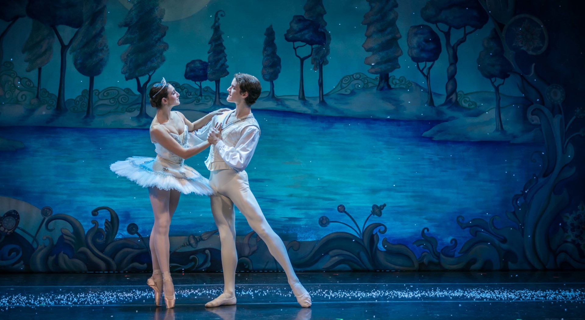 Two ballerinas performing onstage.