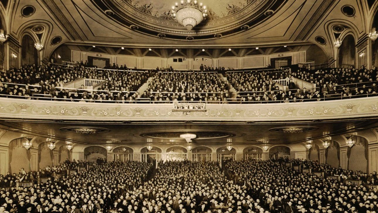 old photograph of poli theater interior filled with people.