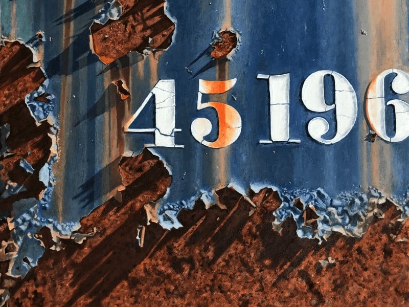A painting by Tracy Spadafora of a weathering dumpster whose paint has been chipped and rusted, the number 45196 appear on the dumpster