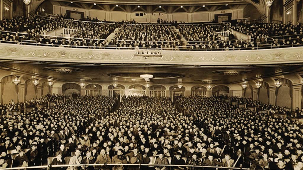 An antique, black and white photo of The Hanover Theatre as Poli's Palace. The theatre is full of patrons. 