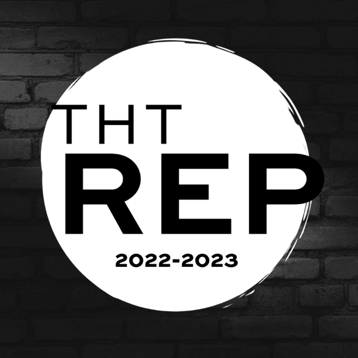 Logo for the THT Repertory in a white circle on a black brick background.