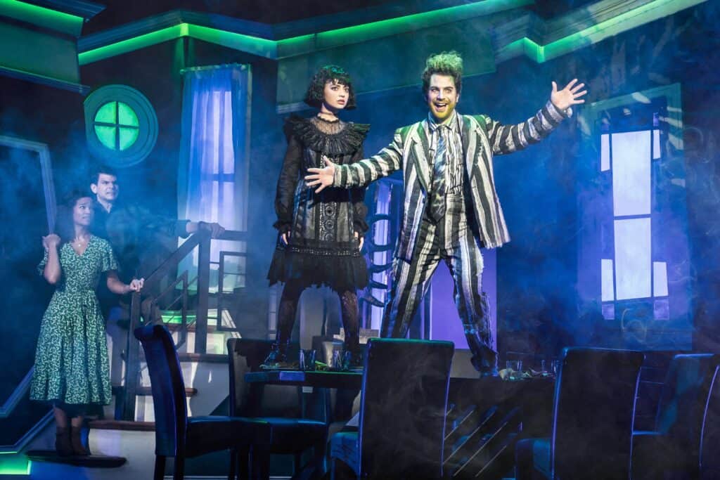 Beetlejuice The Musical National Tour | Pictured (L-R): Britney Coleman (Barbara), Will Burton (Adam), Isabella Esler (Lydia) and Justin Collette (Beetlejuice). Photo by Matthew Murphy, 2022.