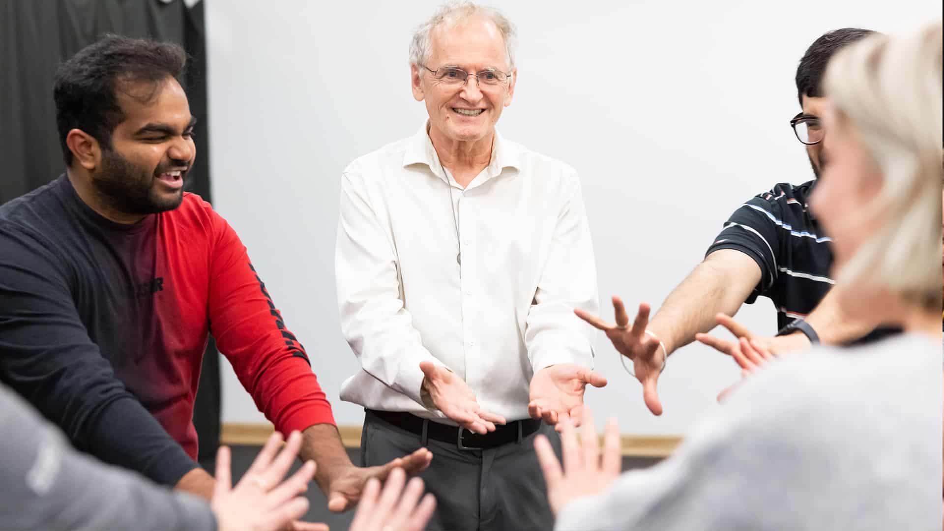 a group of adult improv students during class