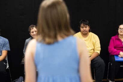 Student delivering a monologue to a class.