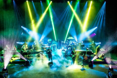 Mannheim Steamroller Christmas by Chip Davis. A shot of the band playing their instruments with fog machines, green, pink, and blue lights. Photo credit to Matt Christine Photography.