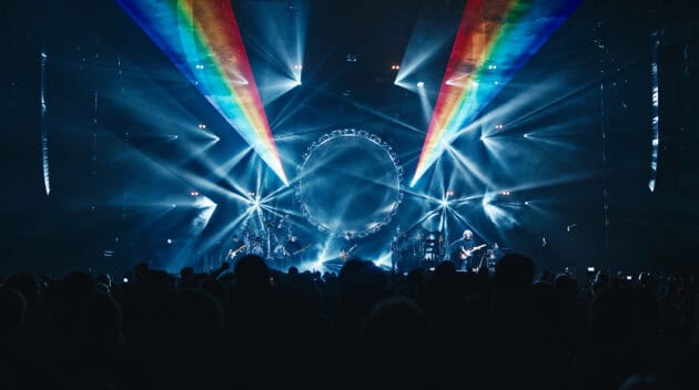 Australian Pink Floyd Show with blue lighting and rainbow lasers.