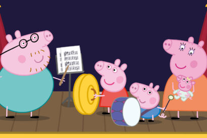 Peppa Pig and her family perform on stage with musical instruments. Daddy Pig conducts with a baton next to a music stand, Peppa holds a large yellow cymbal, George plays a drum with a mallet, and Mummy Pig stands smiling as she holds baby Evie. The stage is framed by red curtains and a dark purple background.