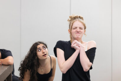 Teen Sketch Comedy Grades 8-12 SUMMER - Hanover Theatre and Conservatory Three young dancers pose dramatically in a bright studio; the central girl clasps her hands and squints, while a girl with curly hair leans by a bench nearby.