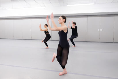Dance Performance Ages 10-14 - Hanover Theatre and Conservatory Three ballet dancers in black leotards leap in unison across a bright rehearsal studio.